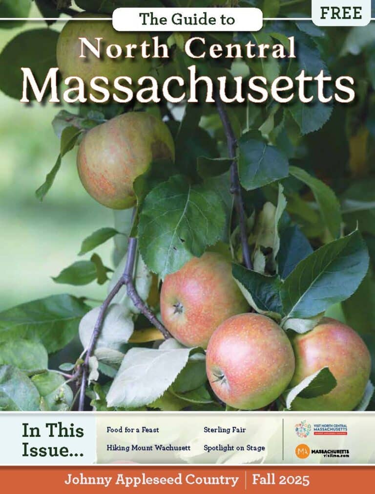 A magazine cover titled The Guide to North Central Massachusetts features apples growing on a tree branch. Headlines mention local highlights, including food, fairs, hiking, and stage performances for Fall 2025 in North Central Massachusetts.