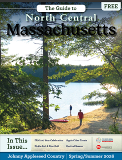 A magazine cover for North Central Massachusetts, featured in a Visitor's Guide, shows people by a lake with trees and sunlight in the background.