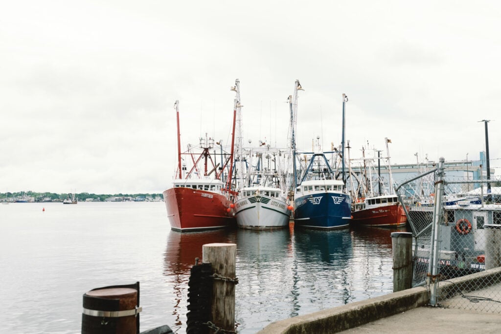 Red, White, and Blue boats lined up in a harbor in New Bedford, Massachusetts.