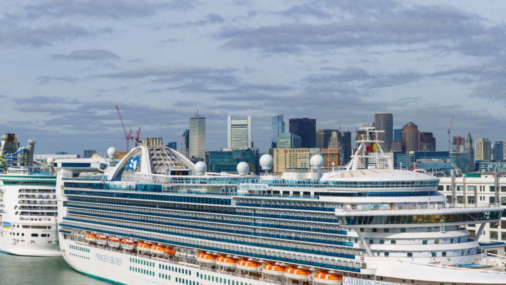 A large cruise ship docs in Boston.