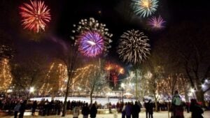 Fireworks illuminate the Frog Pond in Boston Common in Boston, Massachusetts.