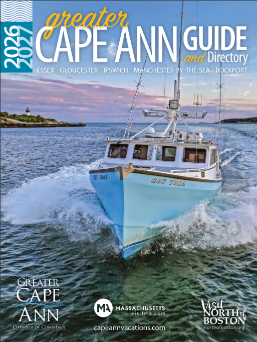 A fishing boat named HOT TUNA moves through the water near a rocky coastline under a cloudy sky. Text above reads “2026-2027 Greater Cape Ann Guide and Directory,” highlighting the official Cape Ann Guide and local chamber logos below.