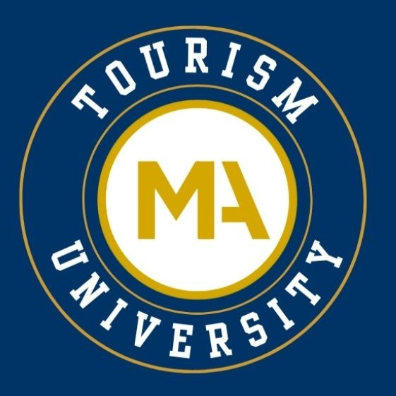 The logo for Tourism University - a circular seal reading Tourism University with "MA" in the middle.