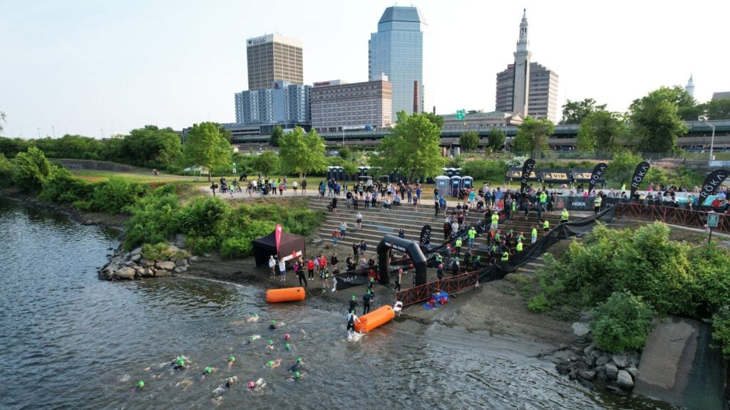 An Ironman Race Finish Line with the Greater Springfield skyline in the background.